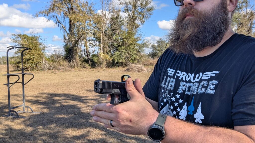 Man meeting two hands together outdoors