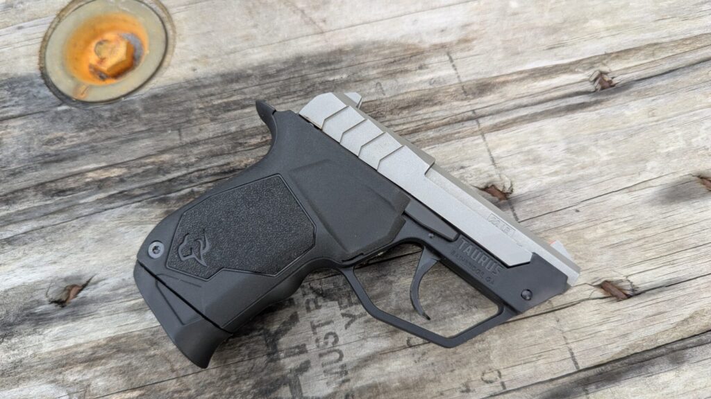 left-side profile of the Taurus 22TUC resting on a wooden table