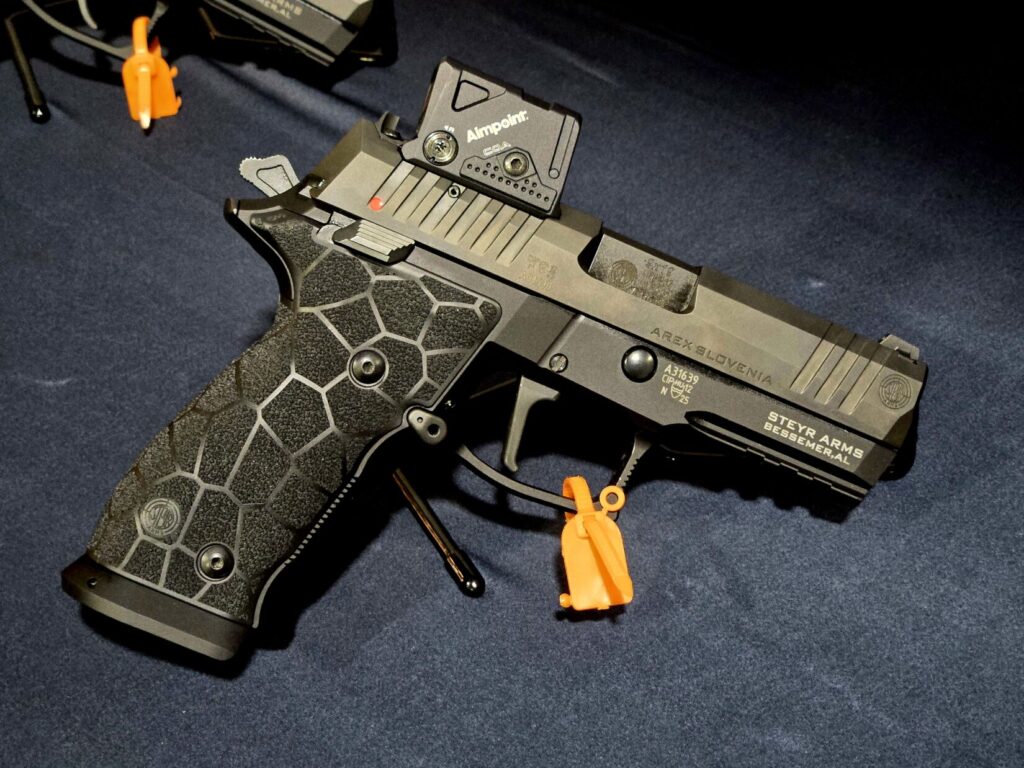 A Steyr pistol cut for the Aimpoint COA on display at Dallas Safari Club