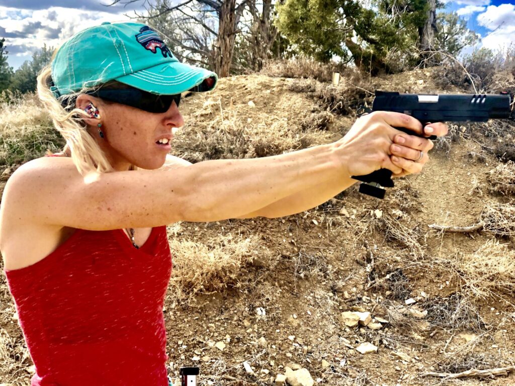 Lanny Barnes shooting a pistol