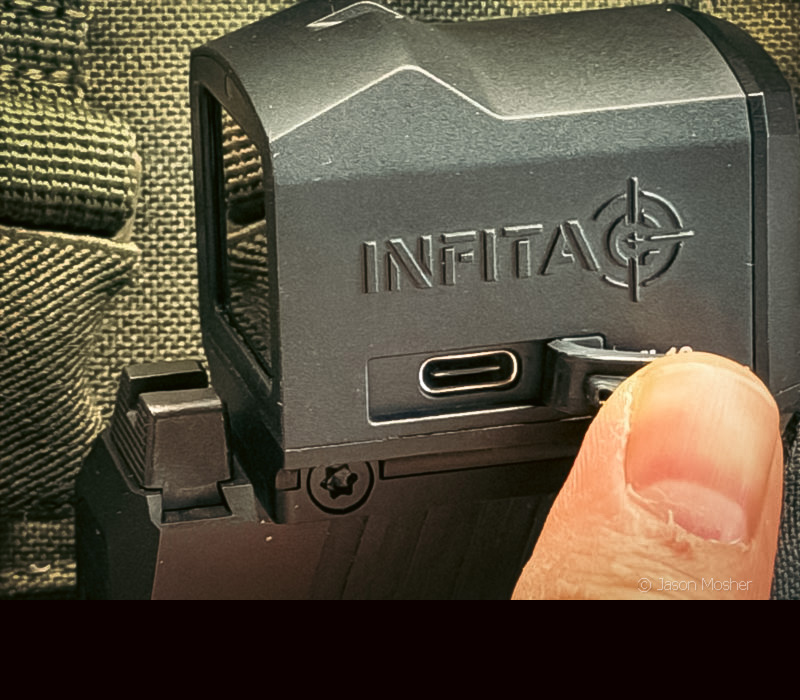 The side of a black thermal optic, showing the slot for a USBc cable to plug in. 