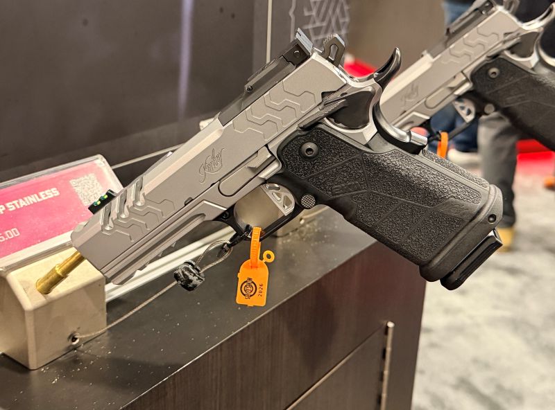 A silver handgun on display at SHOT 2026.