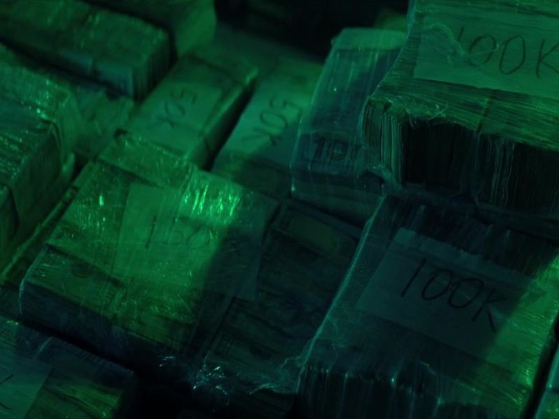 Money wrapped in plastic in square bundles.