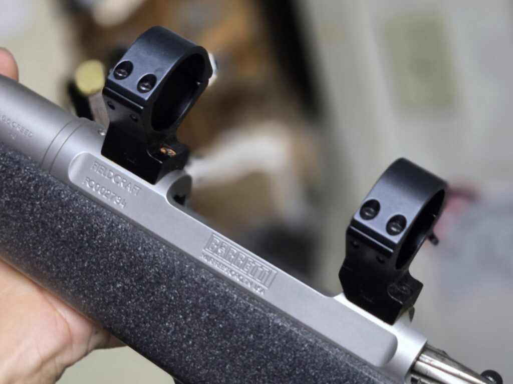 A rifle receiver with scope rings
