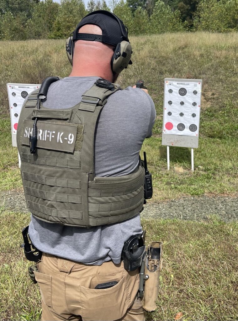 Pictured is a law enforcement k9 officer using the War HOGG Tactical training target