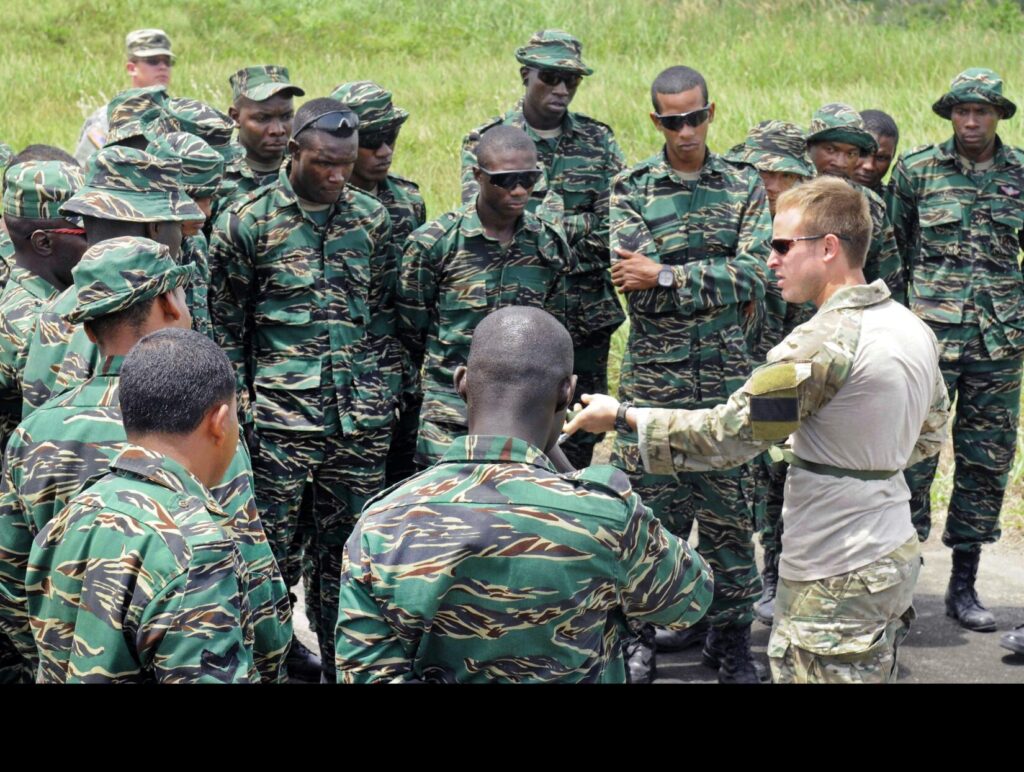 Guyana Defense Force soldiers receive training on air assault techniques and procedures from a special operations service member assigned to the 7th Special Forces Group, near Camp Stephenson, outside the capital city of Georgetown, March 3, 2012. (U.S. Army photo by Sgt. Taresha D. Neal)