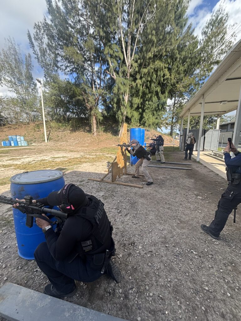 female officers training with rifles from cover