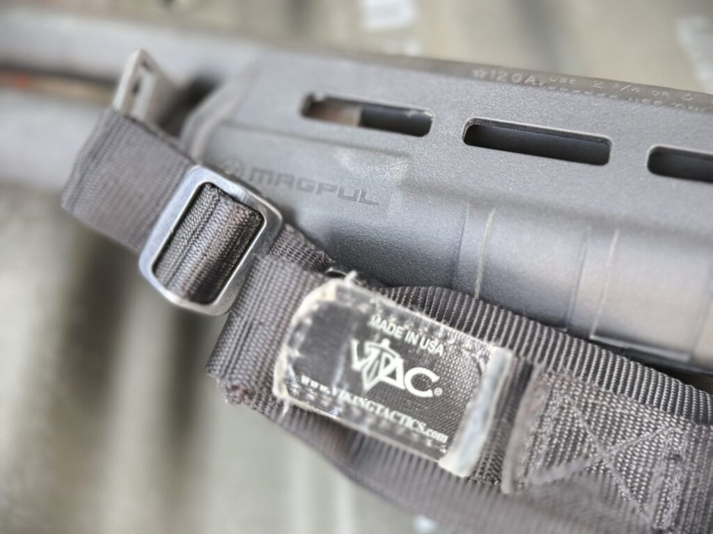 close up view of a Magpul forend for a Remington 870 as well as a Viking Tactics VTAC sling