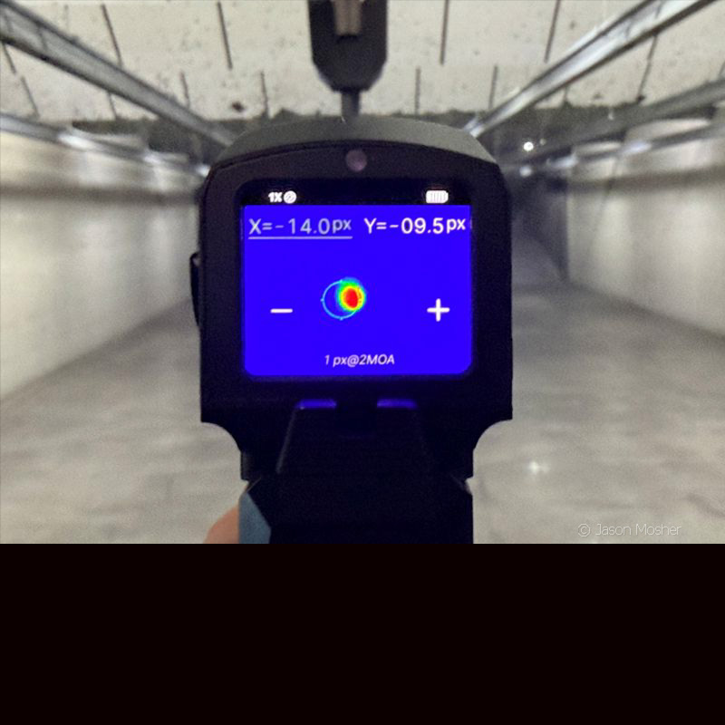 The screen of the FML19 thermal optic, showing the plus and minus buttons for making adjustments to zero it. 