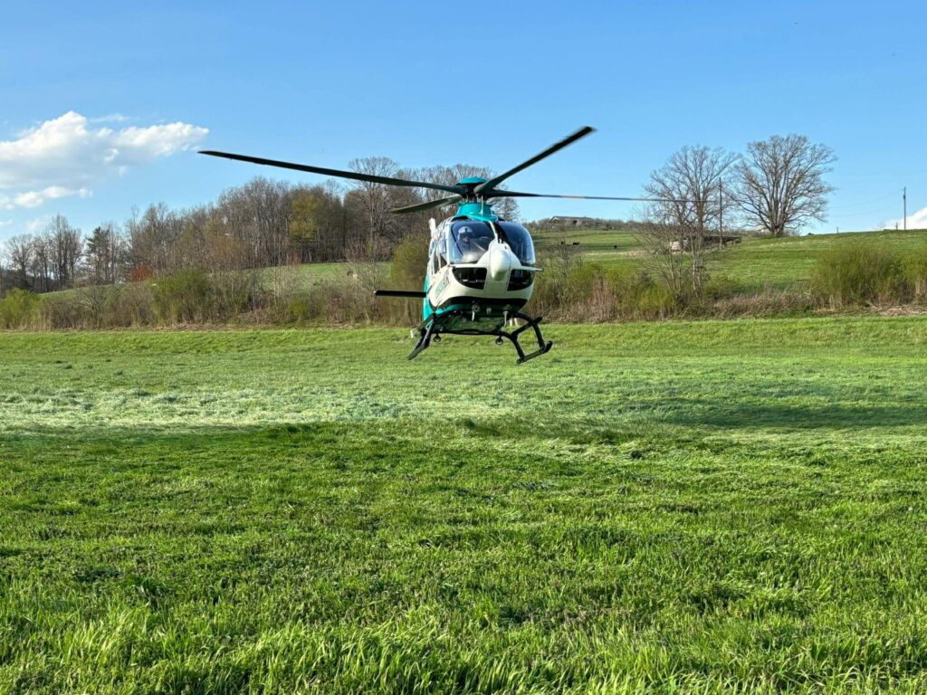 A life flight helicopter landing in a field