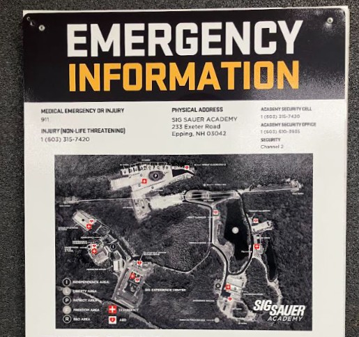 An emergency information sign with a map of a facility