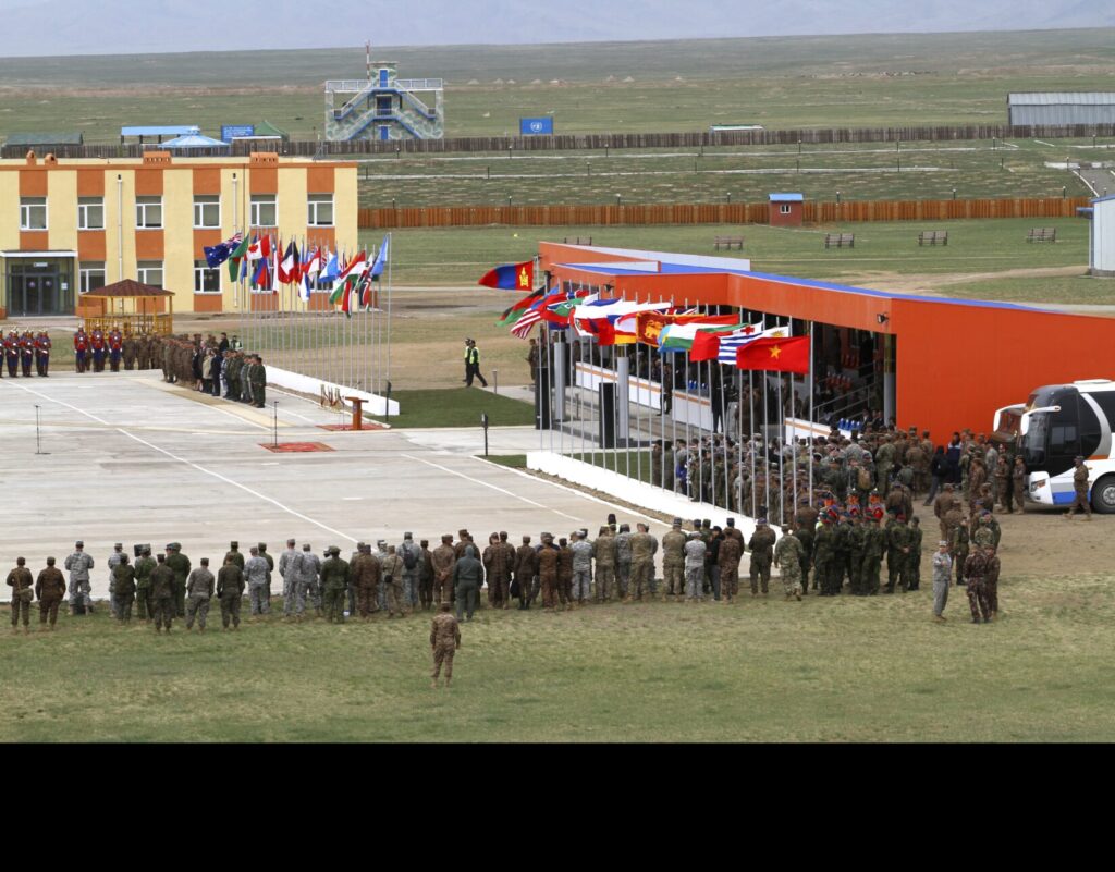A formation of multinational troops participates in the Khaan Quest opening ceremony held at Five Hills Training Center, Mongolia, May 22, 2016. Khaan Quest is an annual multinational peacekeeping operations exercise conducted in Mongolia and is the capstone exercise for this year's Global Peace Operations Initiative program. (U.S. Marine Corps photo by Gunnery Sgt. Melinda Munoz)
