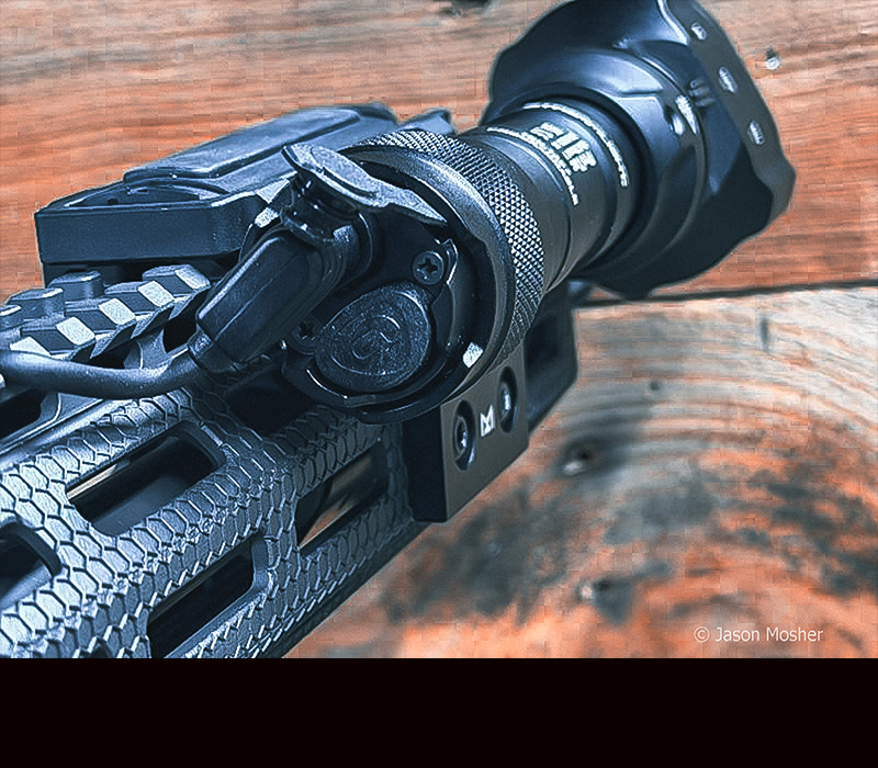 A view of the back of the tail cap on the IR PRO light, showing the power button.