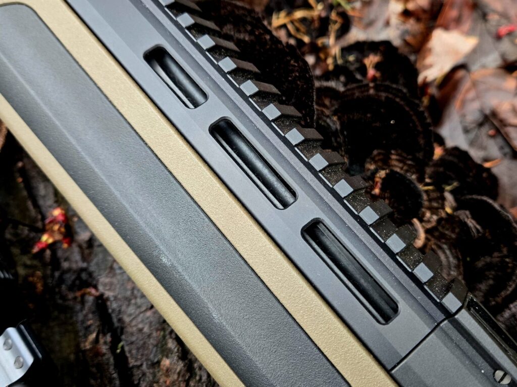 MLOK rail section on a rifle with a picatinny section