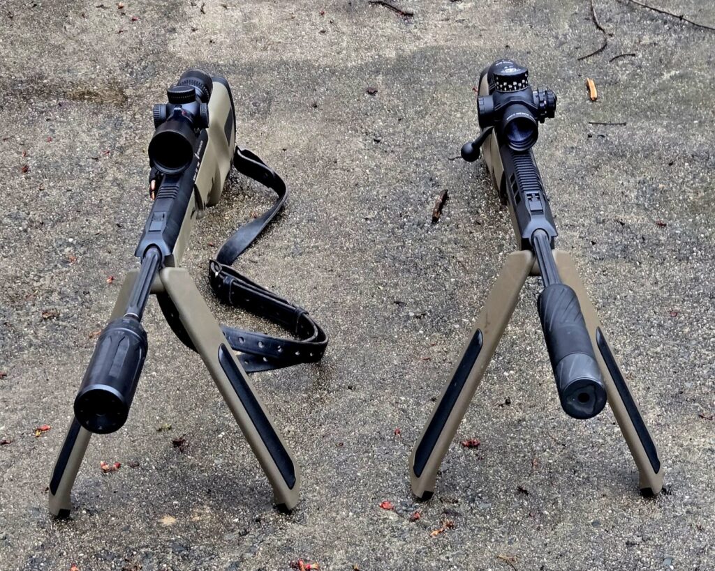 Two rifles on integrated bipods with optics and suppressors