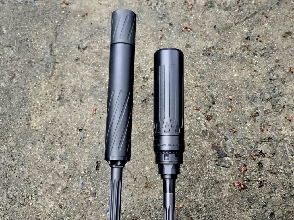 Two rifle barrels side by side with suppressors