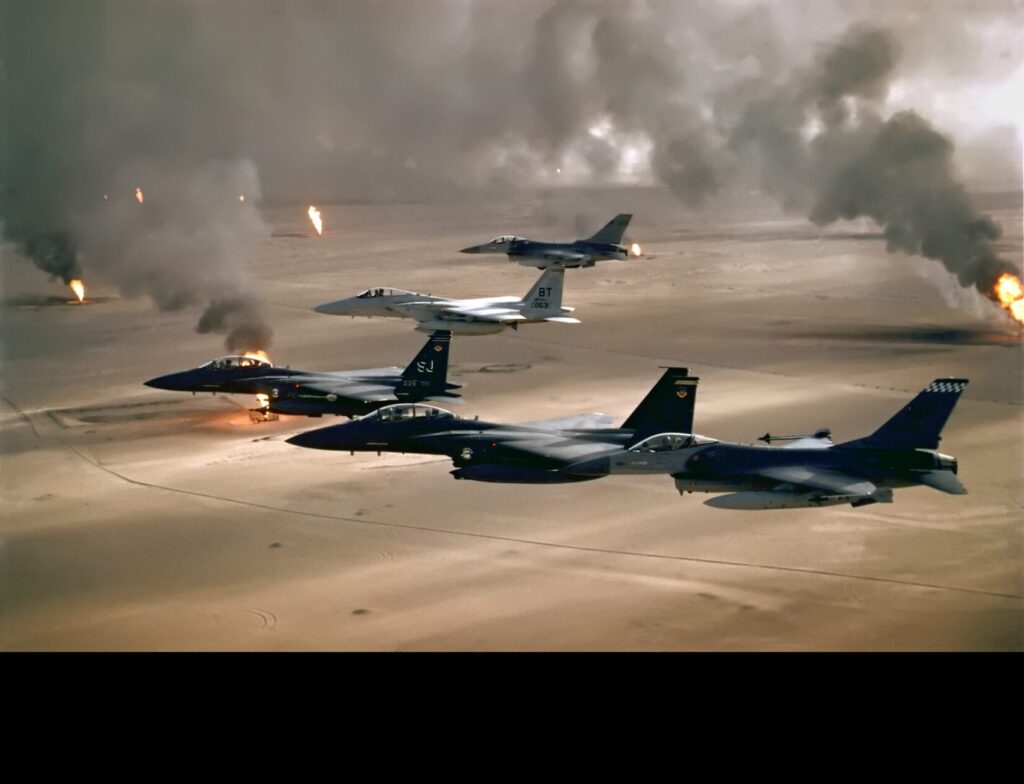 USAF Aircraft of the 4th Fighter Wing Over Kuwaiti Oil Fires, 1991. F‑16s, F‑15Cs, and F‑15Es from the 4th Fighter Wing fly over burning Kuwaiti oil fields set ablaze by retreating Iraqi forces during Operation Desert Storm. 