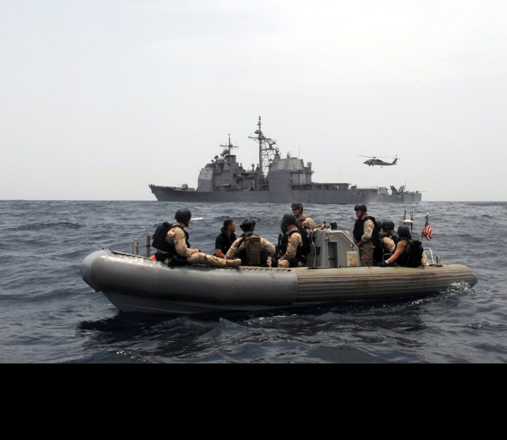 Sailors assigned to the guided-missile cruiser USS Anzio (CG 68) and members of U.S. Coast Guard maritime safety and security team 91104 prepare to investigate a skiff during a maritime security operation in the Gulf of Aden in 2009. Anzio is the flagship for Combined Task Force 151, a multinational task force established to conduct counter-piracy operations off the coast of Somalia. (U.S. Navy photo by Mass Communication Specialist 2nd Class Brian K. Fromal)