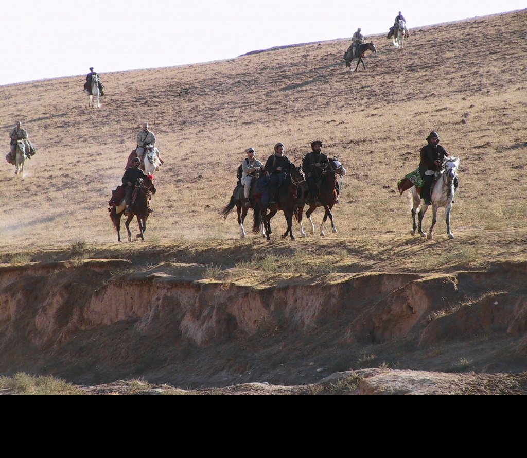 U.S. Special Operations Forces, members of Task Force Dagger, and Afghanistan Commander Abdul Rashid Dostum on horseback in the Dari-a-Souf Valley, Afghanistan, in October 2001. (Master Sgt. Chris Spence, FOB-53/U.S. Army, United States Special Operations Command)