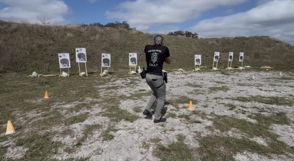 pictured is an LEO starting his shooting on the move laterally during the War HOGG "L" CQB drill during a War HOGG Tactical police firearms training course