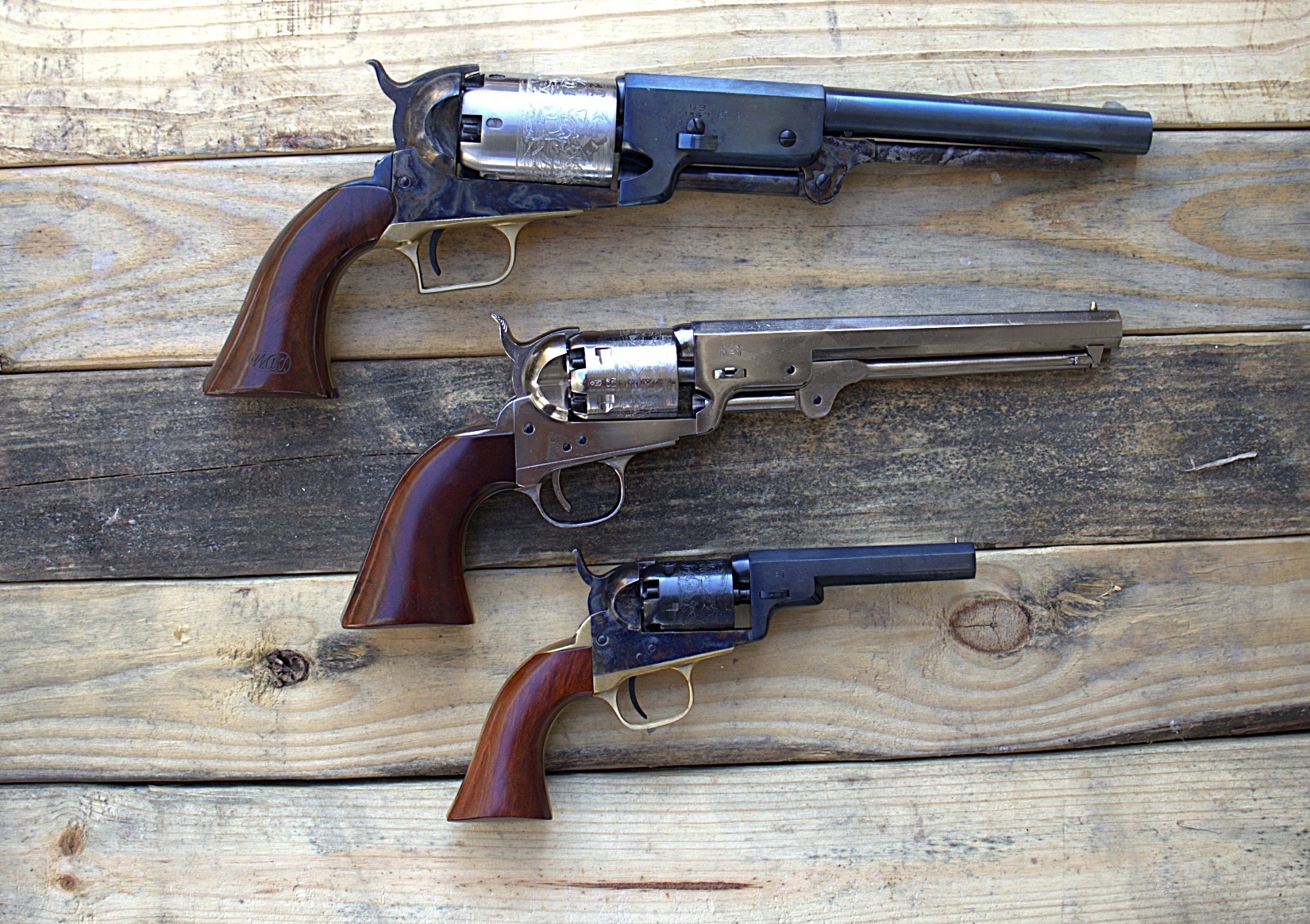 top to bottom: 1847 walker revolver, 1851 navy, colt pocket model revolver