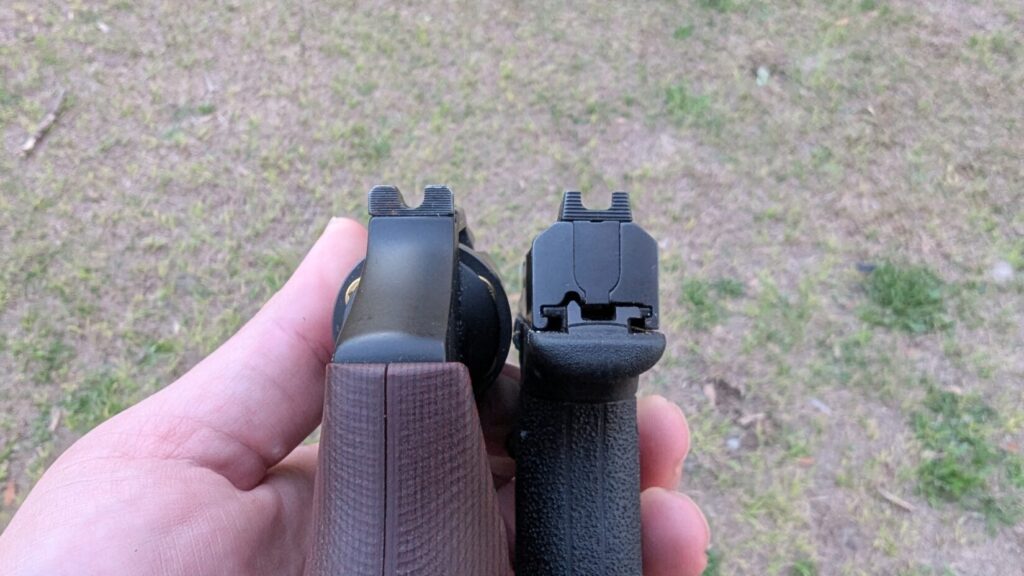 A rear view comparison of a snub-nosed revolver and a Bodyguard 2.0, showing the difference in slide and frame width.
