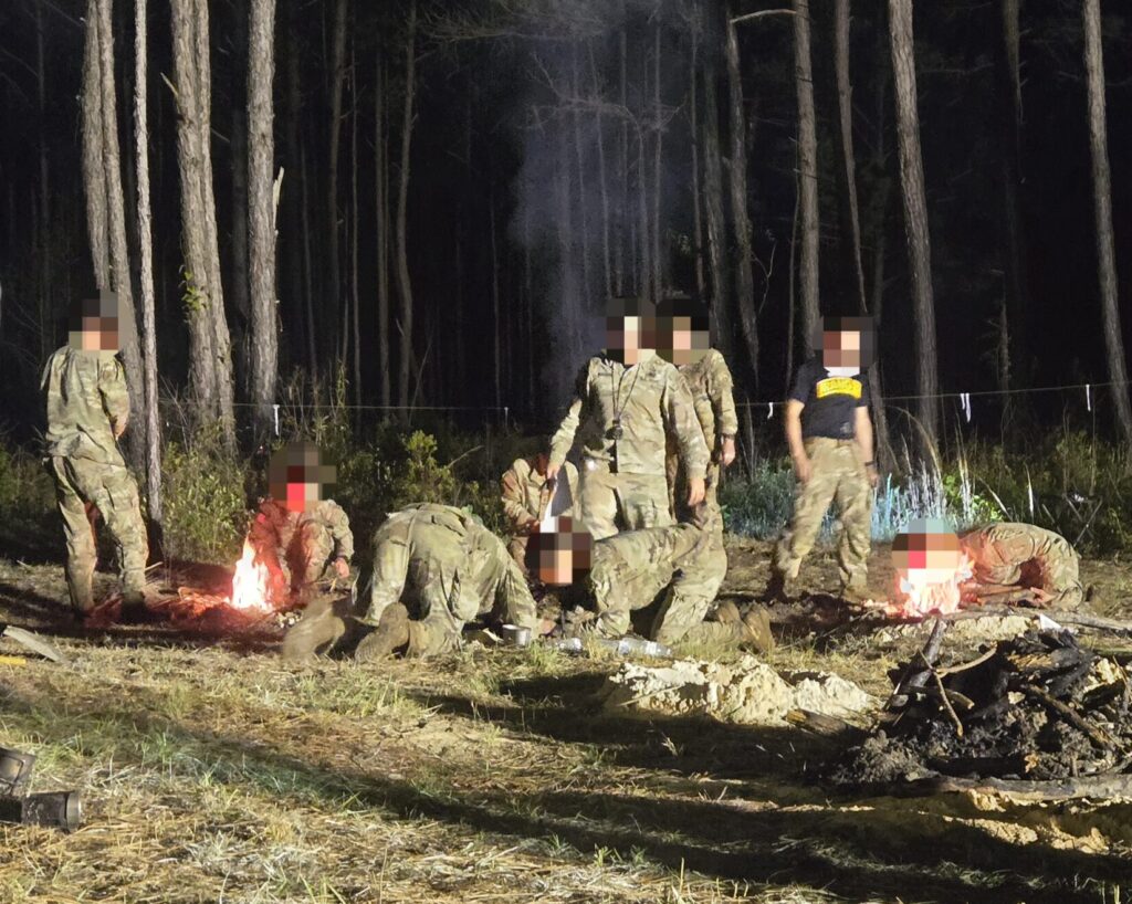 Men work around campfires in the woods