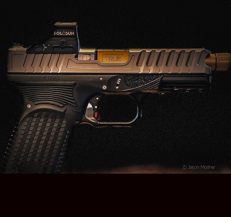 A black and silver handgun with a gold barrel. 