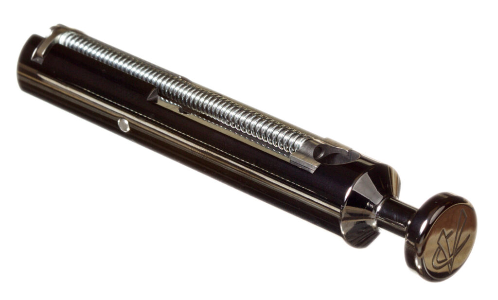 A pistol bolt against a white background