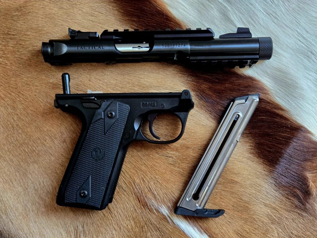 A pistol with upper lower and magazine on an animal fur