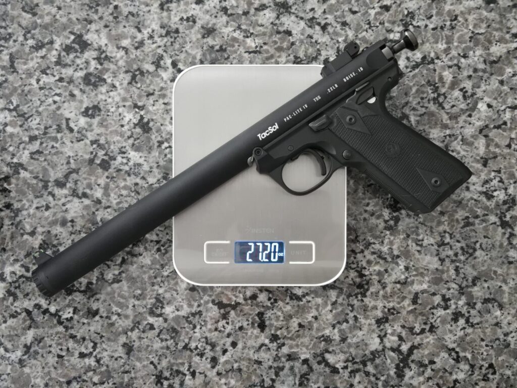 A pistol on a kitchen scale