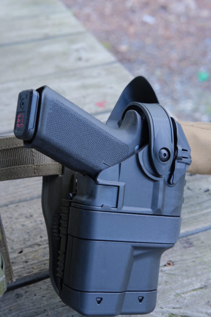 The Ruger RXM with full size black grip frame fully seated in a Safariland Ballast duty holster