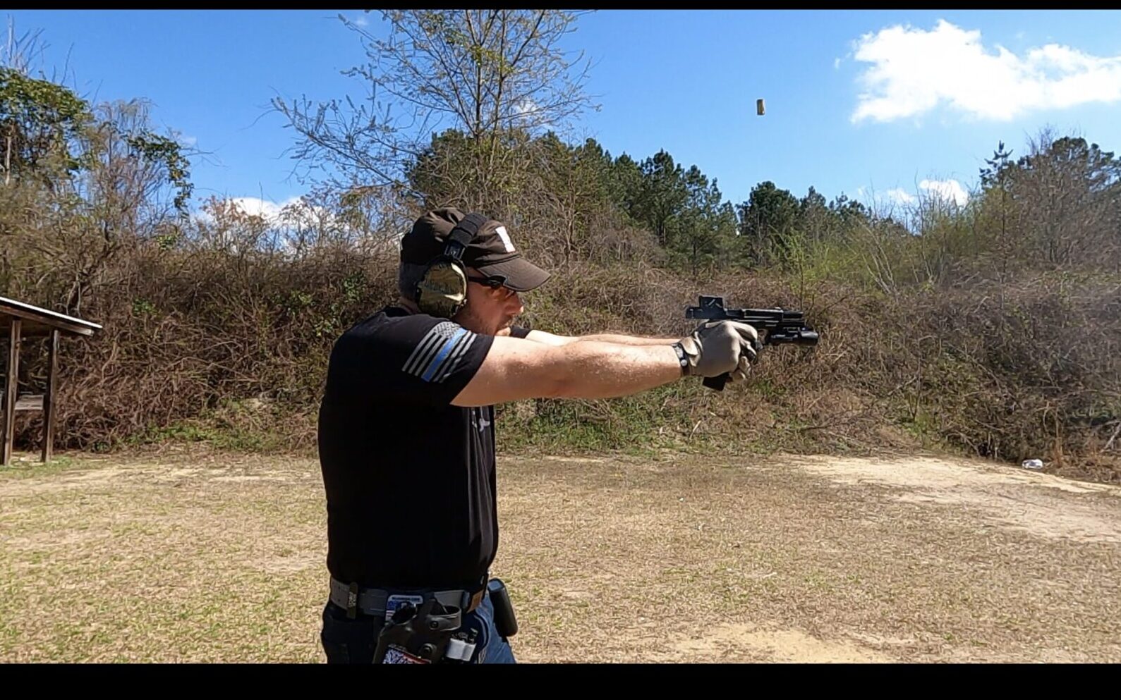 Rick Hogg of War HOGG Tactical draws from the holster wearing gloves during an overview of the Springfield Armory Echelon x Aimpoint COA