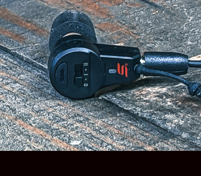 A view of the side of the PRO Impulse Charge ear buds, showing the manual switch.