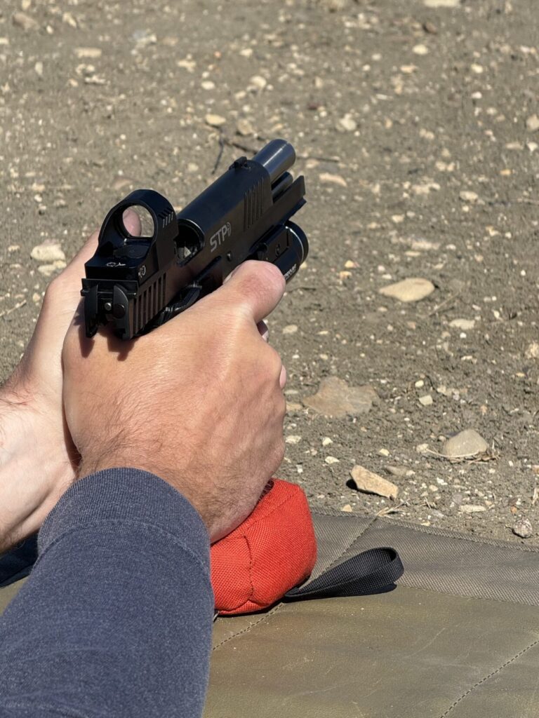 Chris Rhodes method for supporting a handgun to zero it.