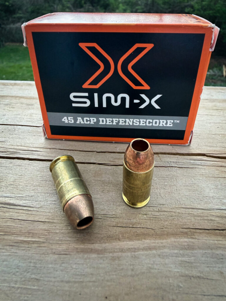 an orange and black box of handgun ammunition