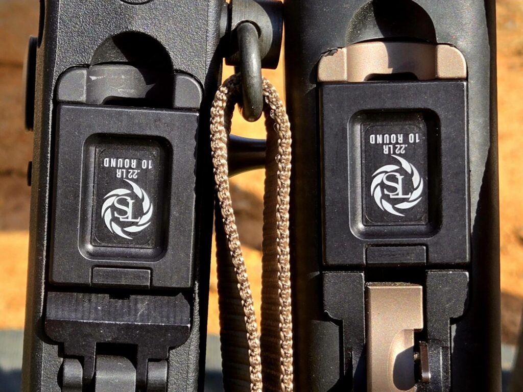 Two rifles with magazines inserted.