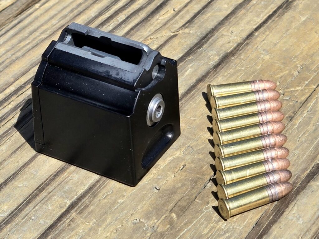 A rotary box magazine and 10 rounds of ammunition