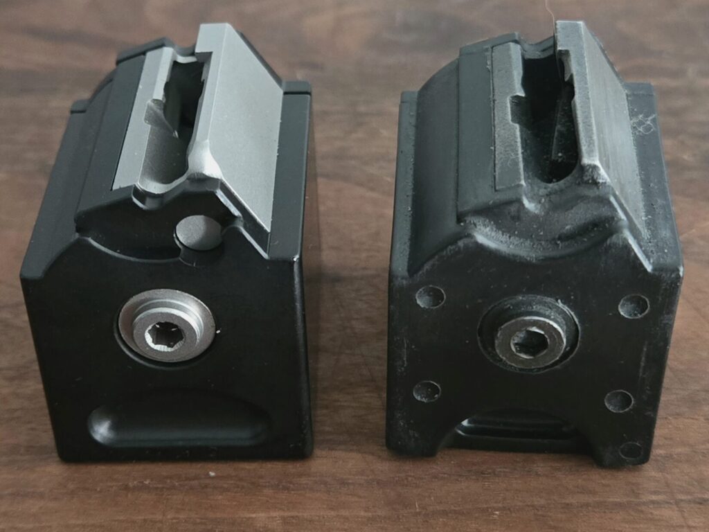 Two rotary rifle magazines facing forward