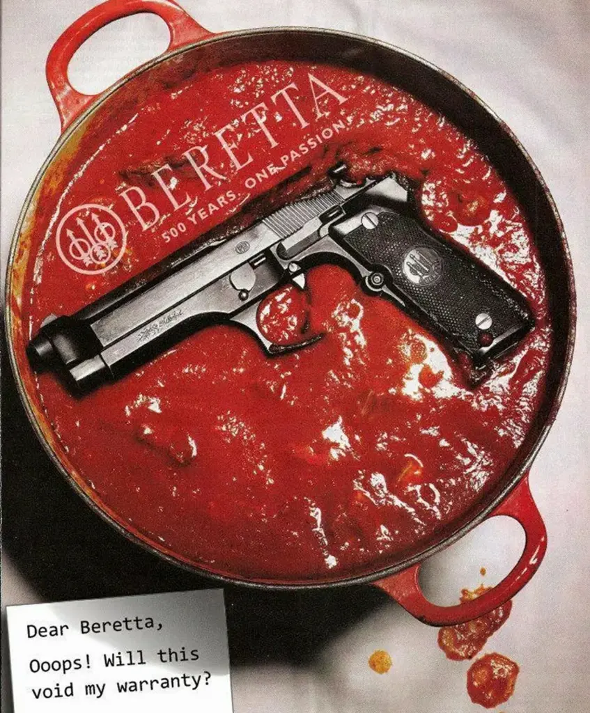 A Beretta 92 pistol resting in a pot of marinara sauce, a nod to the company's Italian roots.