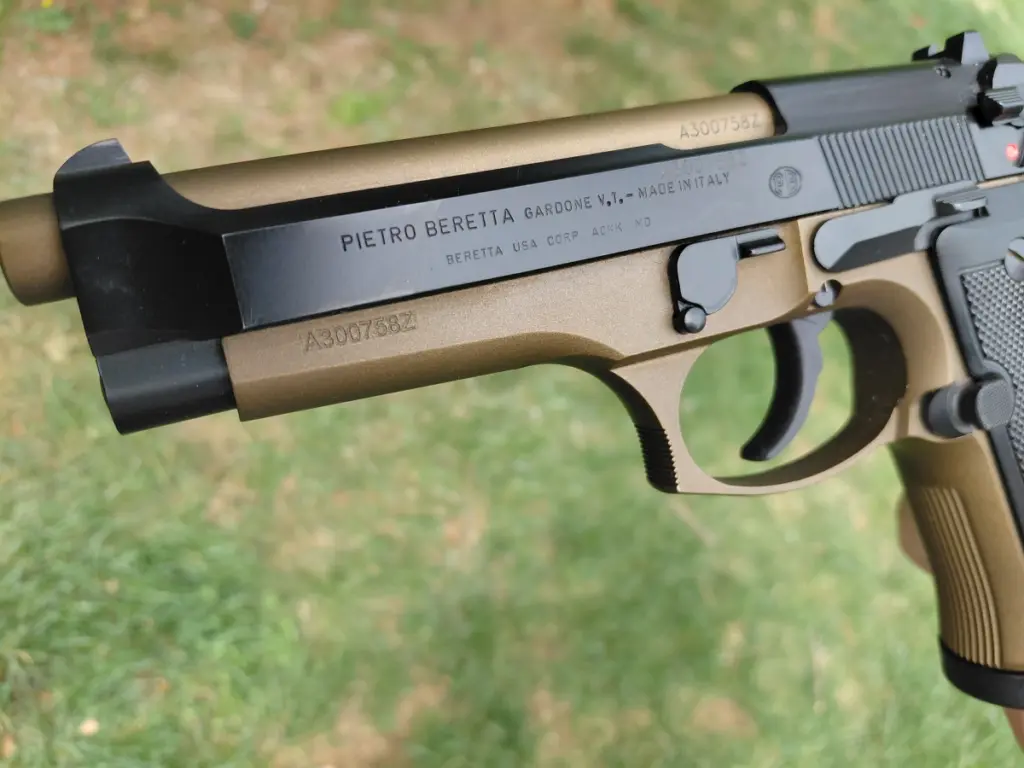 The slide of a Beretta 92G pistol stamped with the Pietro Beretta name, PB logo, and made in Italy