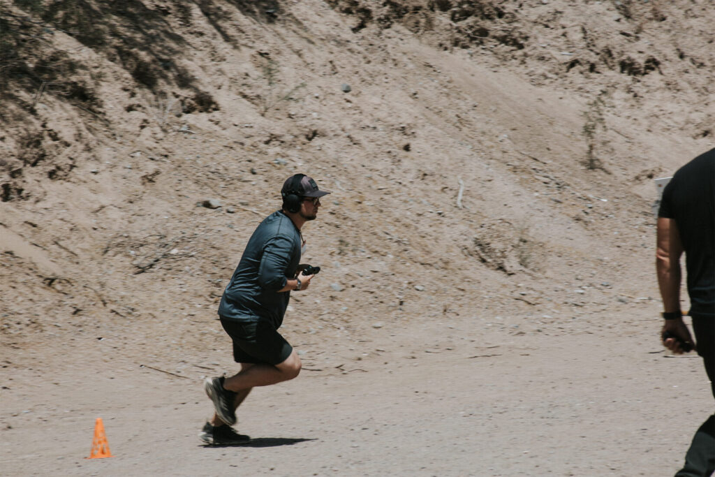 Man running a pistol stage.