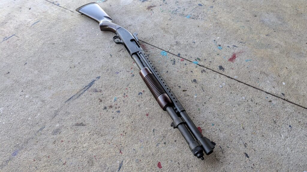 A low-angle, perspective shot of the shotgun resting