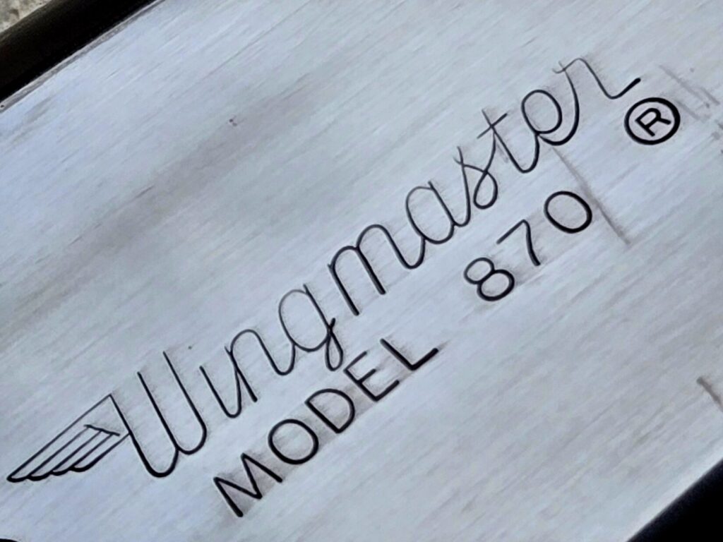 The engraving on the side of a Wingmaster receiver