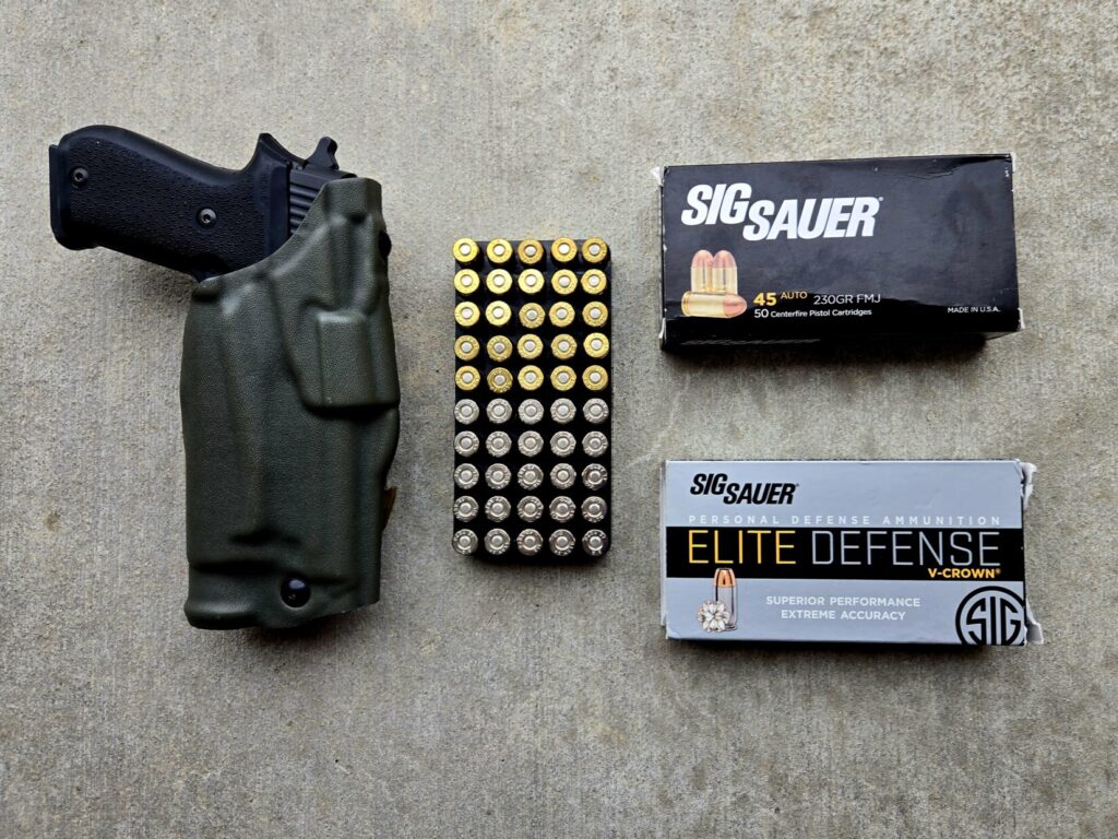 A pistol in a holster next to a box of ammunition with additional boxes nearby.