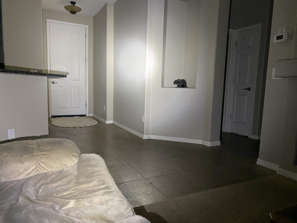weaponlight beam and spill in an indoor room