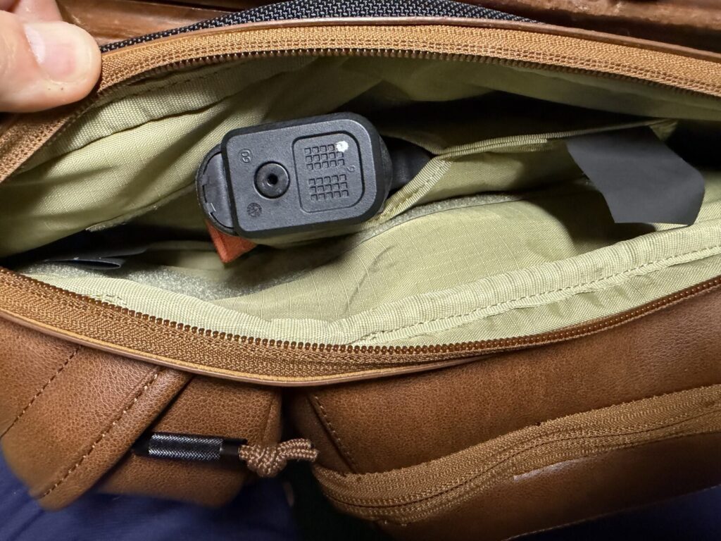 upscale 3 brown leather sling bag with Glock 26.