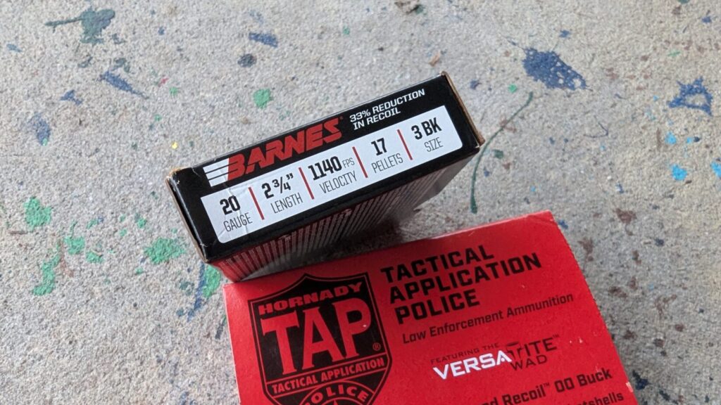 A black box of Barnes 20-gauge 3 BK size ammunition resting on top of a red box of Hornady TAP shotgun shells.