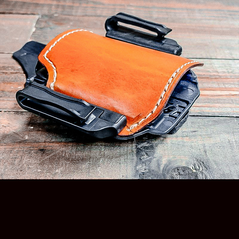 The Shenandoah holster laying on a wood table.
