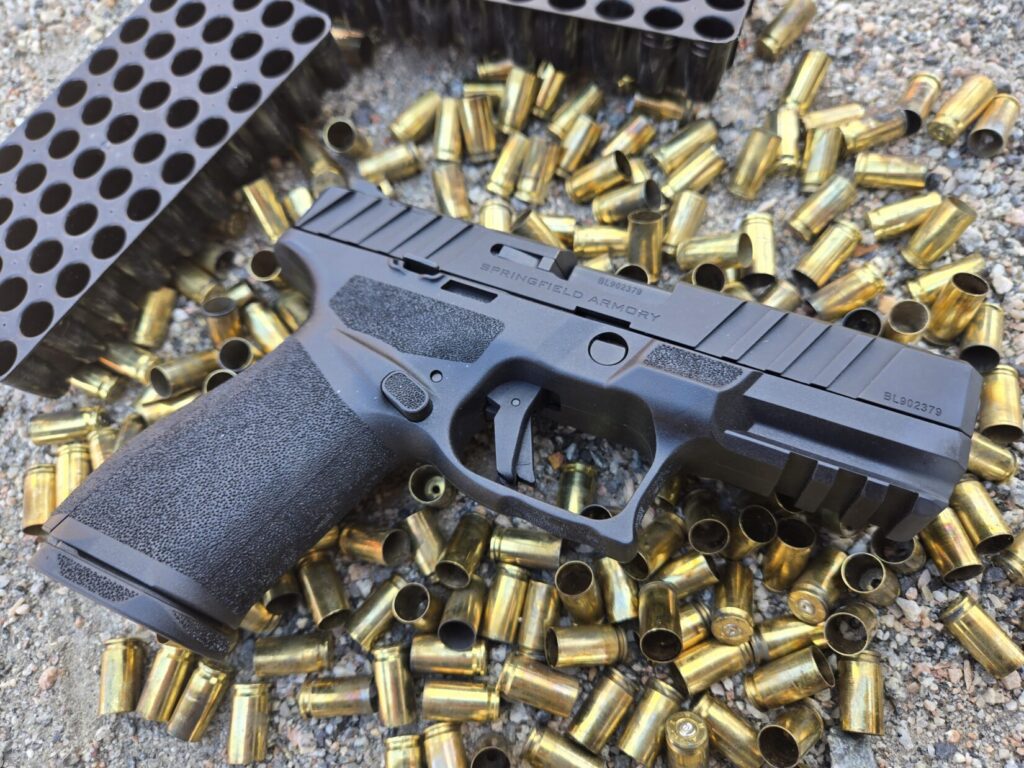 A pistol on top of spent brass